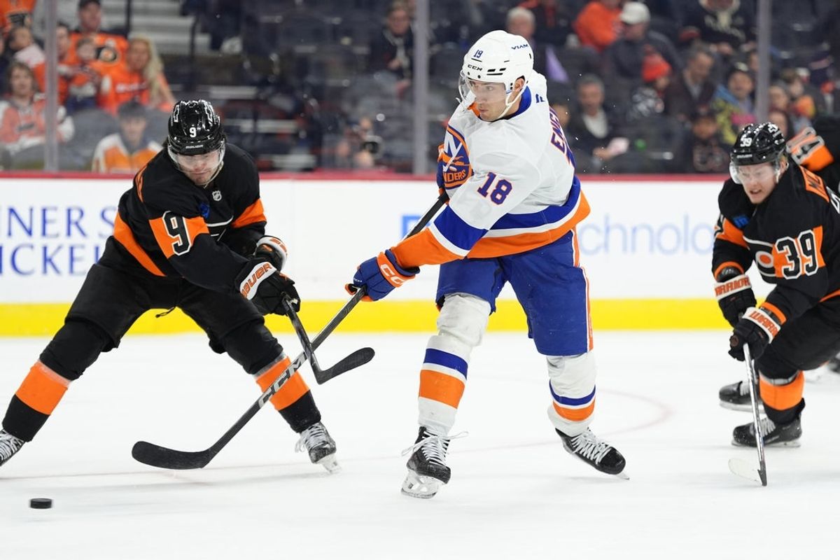 Apr 12, 2025; Philadelphia, Pennsylvania, USA; New York Islanders left wing Pierre Engvall (18) shoots the puck against the Philadelphia Flyers in the first period at Wells Fargo Center. Mandatory Credit: Kyle Ross-Imagn Images
