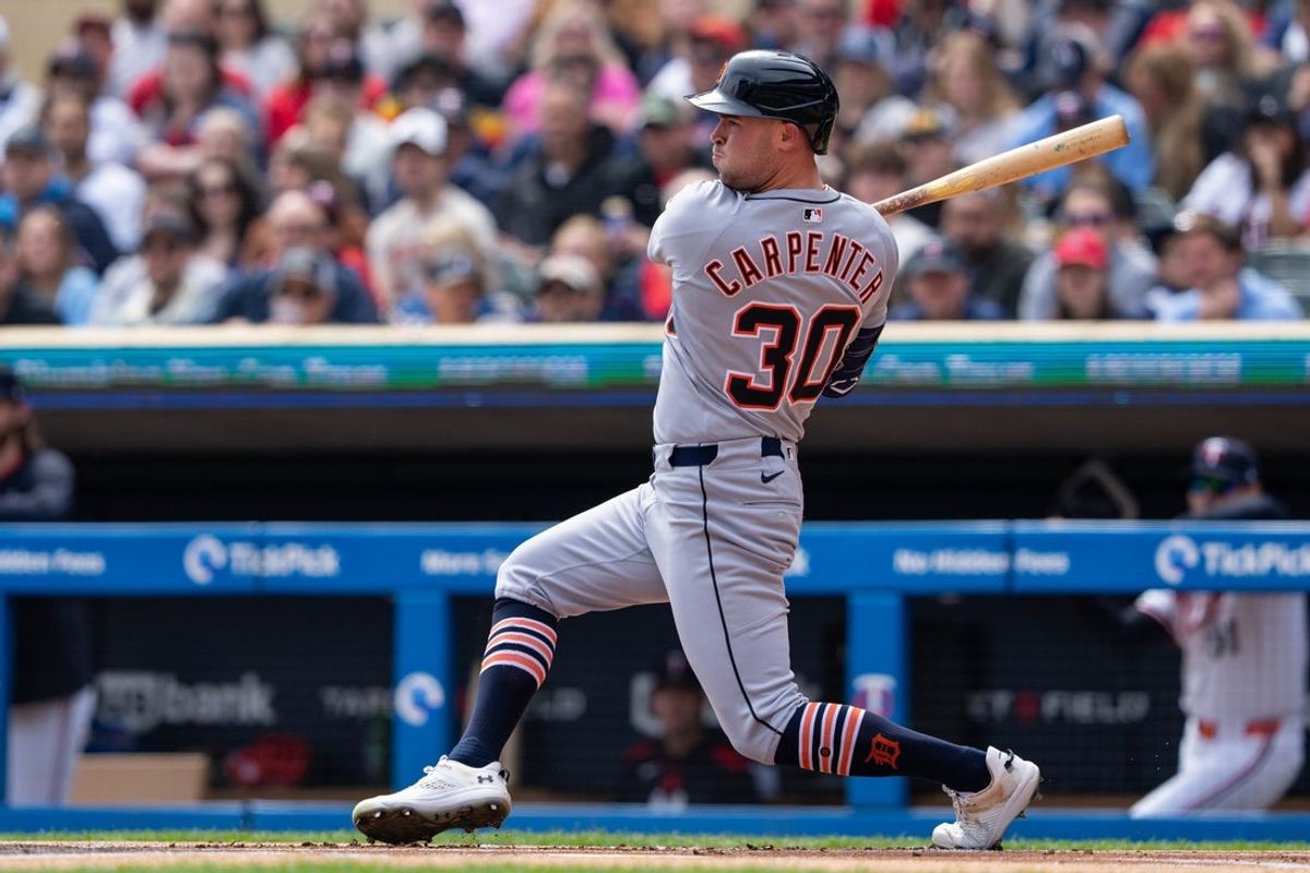 Apr 12, 2025; Minneapolis, Minnesota, USA; Detroit Tigers left fielder Kerry Carpenter (30) hits a single during the first inning against the Minnesota Twins at Target Field. Mandatory Credit: Jordan Johnson-Imagn Images