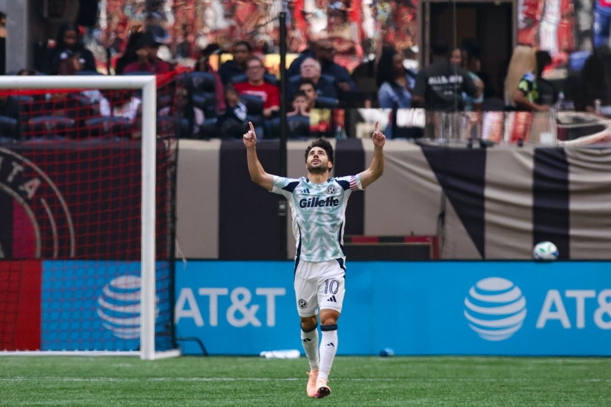 Apr 12, 2025; Atlanta, Georgia, USA; New England Revolution midfielder Carles Gil (10) celebrates after scoring a goal against the Atlanta United in the first half at Mercedes-Benz Stadium. Mandatory Credit: Brett Davis-Imagn Images