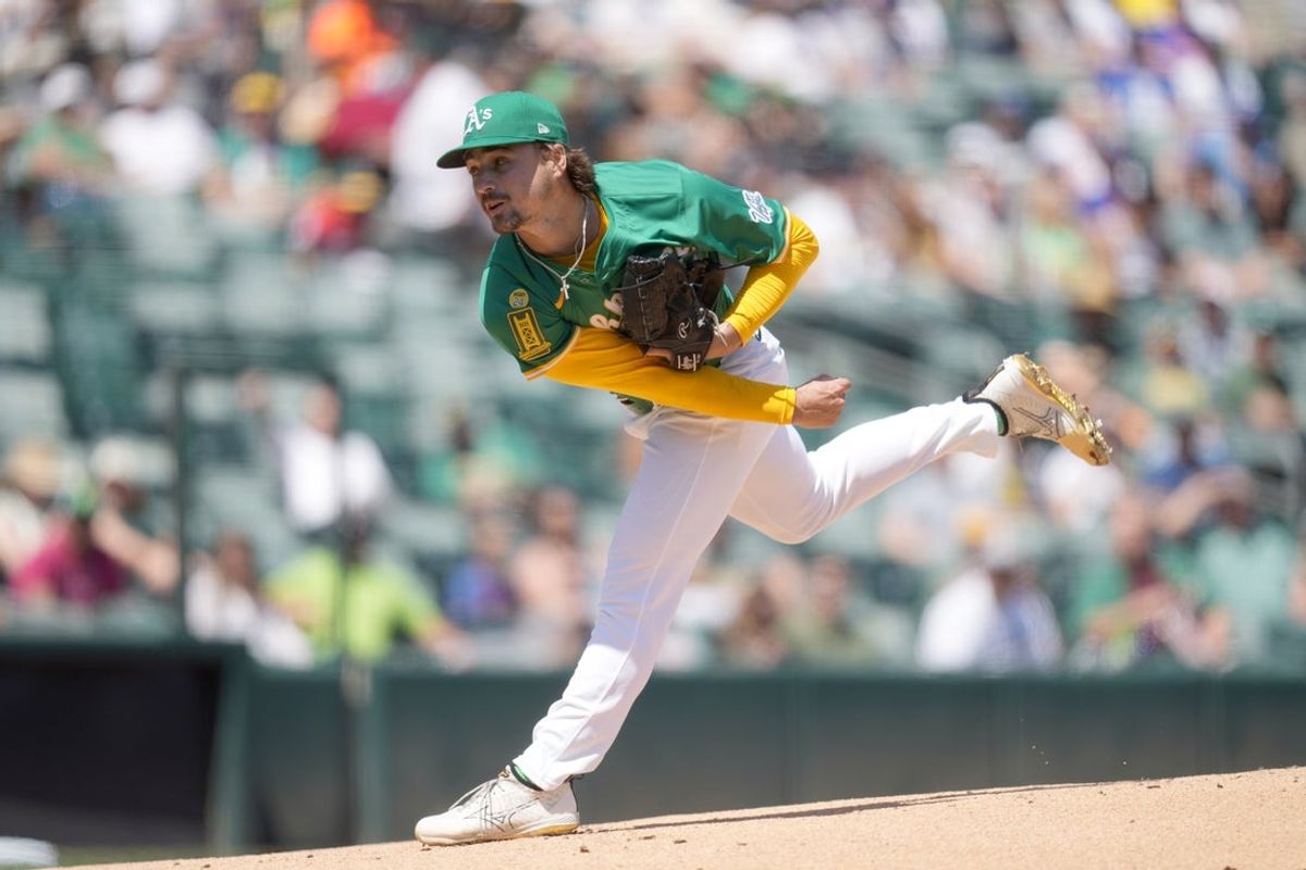 Apr 12, 2025; West Sacramento, California, USA; Athletics pitcher J.T. Ginn (70) follows through on a pitch against the New York Mets in the first inning at Sutter Health Park. Mandatory Credit: Cary Edmondson-Imagn Images