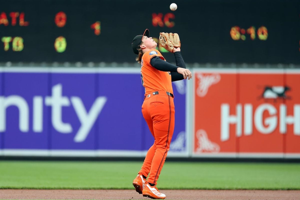 Apr 12, 2025; Baltimore, Maryland, USA; Baltimore Orioles second baseman Jackson Holliday (7) secures a fly ball for an out during the first inning against the Toronto Blue Jays at Oriole Park at Camden Yards. Mandatory Credit: Daniel Kucin Jr.-Imagn Images