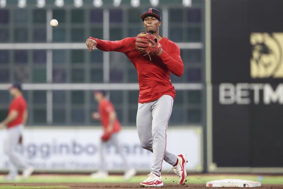 Apr 12, 2025; Houston, Texas, USA; Los Angeles Angels second baseman Kyren Paris (19) throws the ball during practice before the game against the Houston Astros at Daikin Park. Mandatory Credit: Troy Taormina-Imagn Images