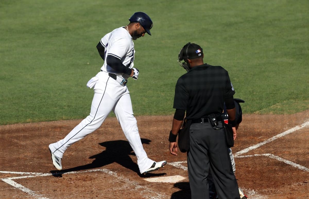 Apr 12, 2025; St. Petersburg, Florida, USA;  Tampa Bay Rays designated hitter Yandy Diaz (2) scores a run against the Atlanta Braves during the third inning at George M. Steinbrenner Field. Mandatory Credit: Kim Klement Neitzel-Imagn Images