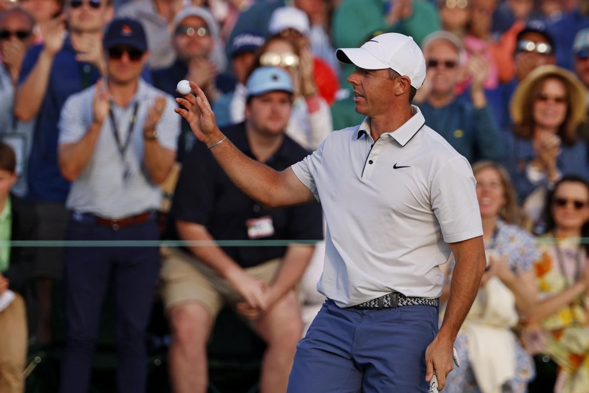 Apr 12, 2025; Augusta, Georgia, USA; Rory McIlroy waves to the patrons after his putt on the 18th green during the third round of the Masters Tournament at Augusta National Golf Club. Mandatory Credit: Peter Casey-Imagn Images