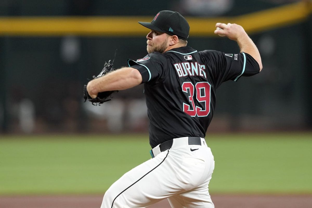 Apr 12, 2025; Phoenix, Arizona, USA; Arizona Diamondbacks pitcher Corbin Burnes (39) pitches against the Milwaukee Brewers during the first inning at Chase Field. Mandatory Credit: Joe Camporeale-Imagn Images