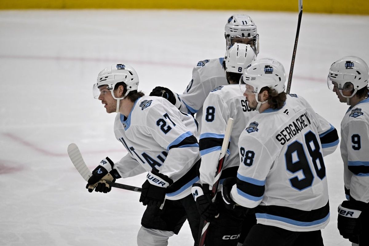 Apr 12, 2025; Dallas, Texas, USA; Utah Hockey Club center Barrett Hayton (27) and center Nick Schmaltz (8) and defenseman Mikhail Sergachev (98) and center Clayton Keller (9) celebrates a power play goal scored by Hayton against the Dallas Stars during the first period at the American Airlines Center. Mandatory Credit: Jerome Miron-Imagn Images