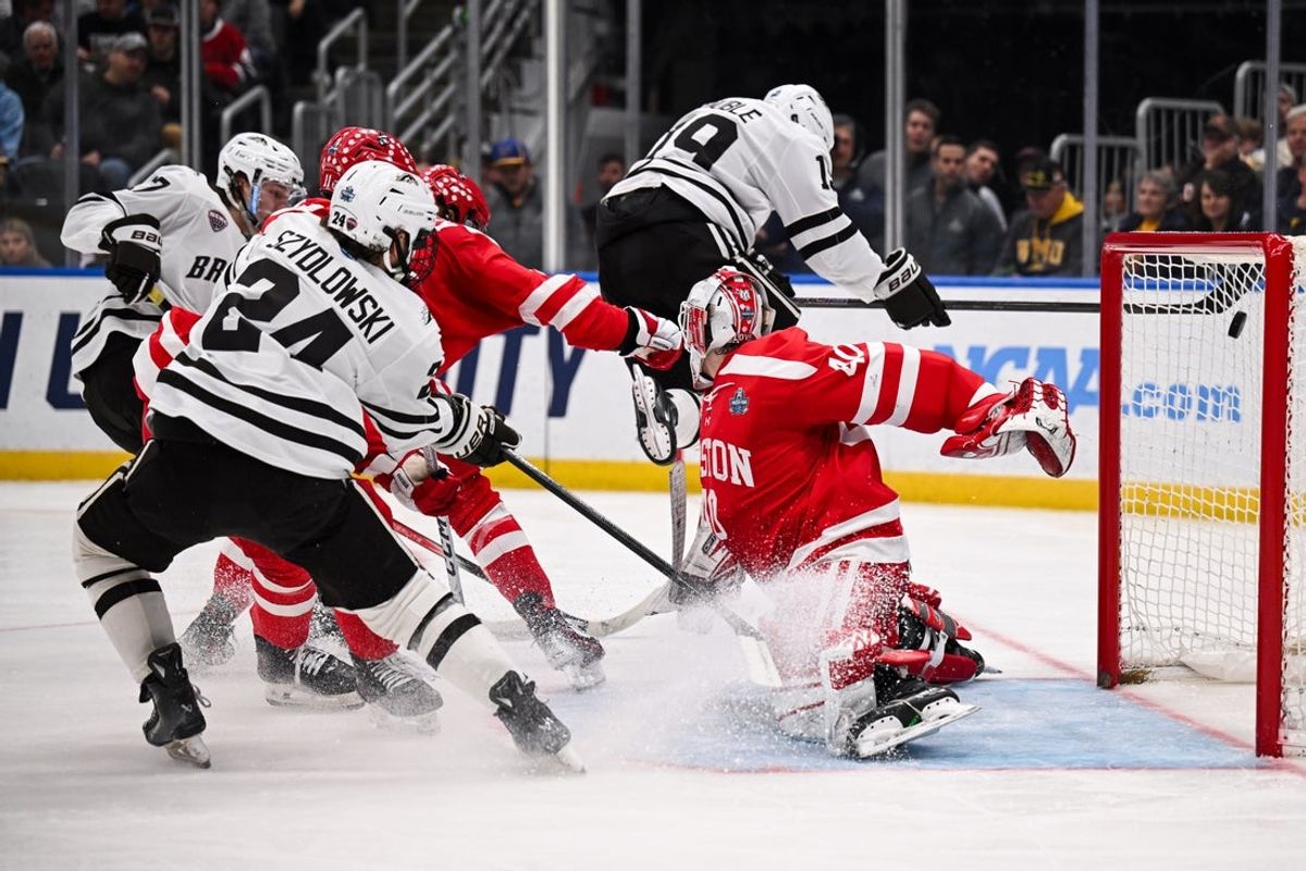 Apr 12, 2025; St. Louis, Missouri, UNITED STATES; Western Michigan Broncos forward Ty Henricks (17) scores a goal against the Boston University Terriers during the second period of the Frozen Four college ice hockey national championship at Enterprise Center. Mandatory Credit: Connor Hamilton-Imagn Images