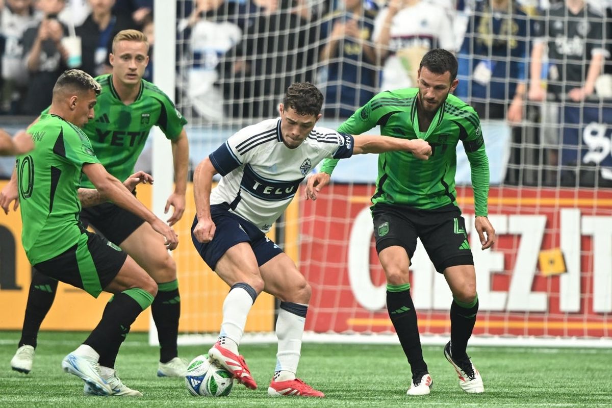 Apr 12, 2025; Vancouver, British Columbia, CAN;  Austin FC defender Brendan Hines-Ike (4) battles for the ball against Vancouver Whitecaps FC midfielder Sebastian Berhalter (16) during the second half at BC Place. Mandatory Credit: Anne-Marie Sorvin-Imagn Images