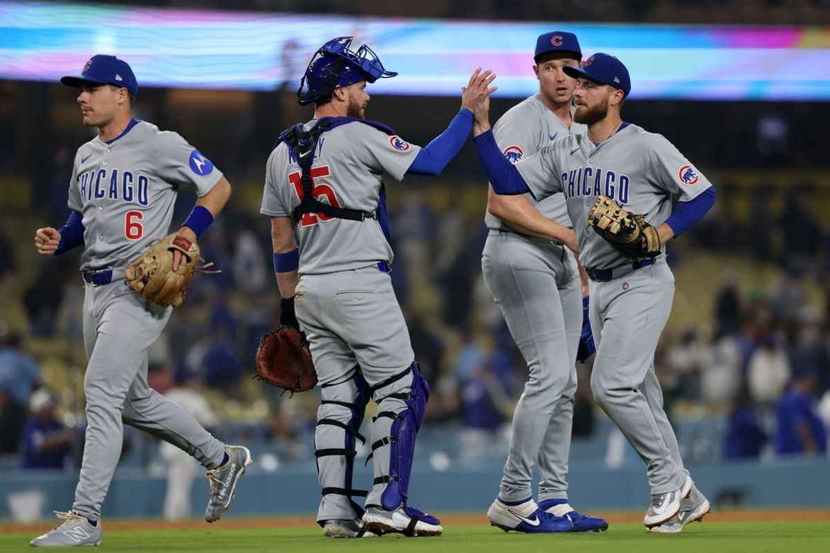 Apr 12, 2025; Los Angeles, California, USA; Chicago Cubs catcher Carson Kelly (15) and first base Michael Busch (29) react after defeating the Los Angeles Dodgers at Dodger Stadium. Mandatory Credit: Kiyoshi Mio-Imagn Images