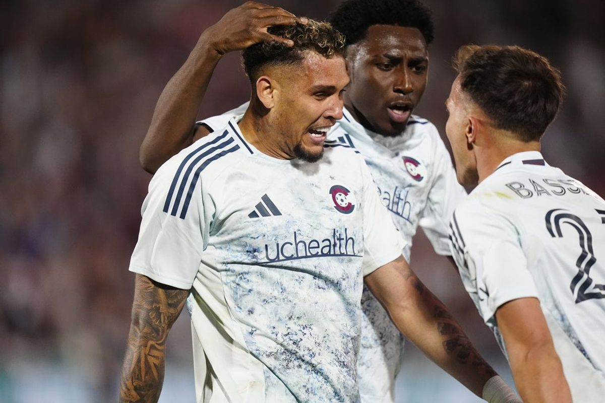 Apr 12, 2025; Commerce City, Colorado, USA;Colorado Rapids forward Rafael Navarro (9) celebrates his goal with forward Darren Yapi (77) and midfielder Cole Bassett (23) in the second half against San Diego FC at Dick's Sporting Goods Park. Mandatory Credit: Ron Chenoy-Imagn Images
