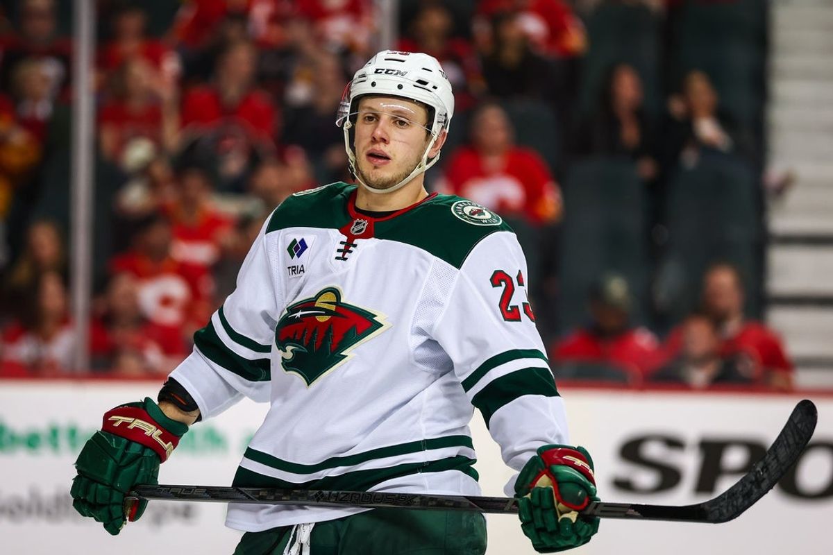 Apr 11, 2025; Calgary, Alberta, CAN; Minnesota Wild center Marco Rossi (23) against the Calgary Flames during the third period at Scotiabank Saddledome. Mandatory Credit: Sergei Belski-Imagn Images
