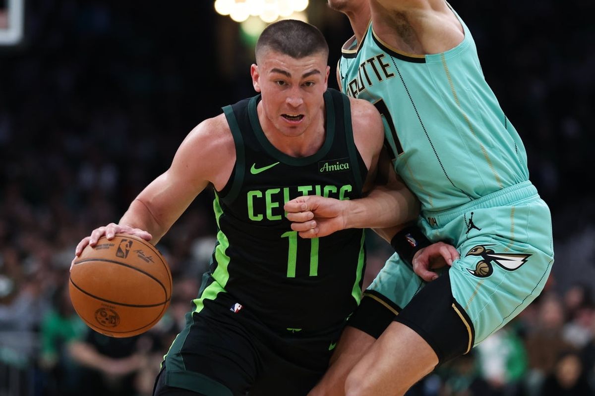 Apr 13, 2025; Boston, Massachusetts, USA; Boston Celtics guard Payton Pritchard (11) drives to the basket during the first half against the Charlotte Hornets at TD Garden. Mandatory Credit: Paul Rutherford-Imagn Images