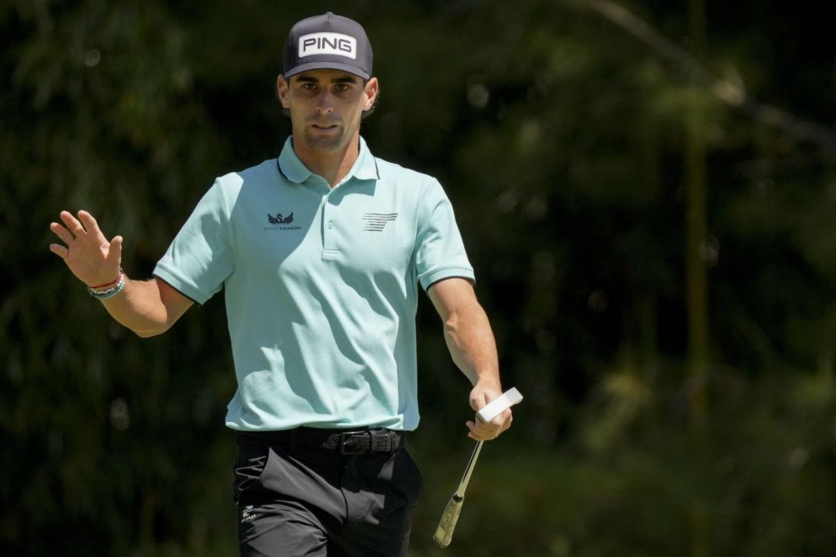Apr 13, 2025; Augusta, Georgia, USA; Joaquin Niemann waves to patrons after chipping onto the no. 4 green during the final round of the Masters Tournament at Augusta National Golf Club. Mandatory Credit: Grace Smith-Imagn Images