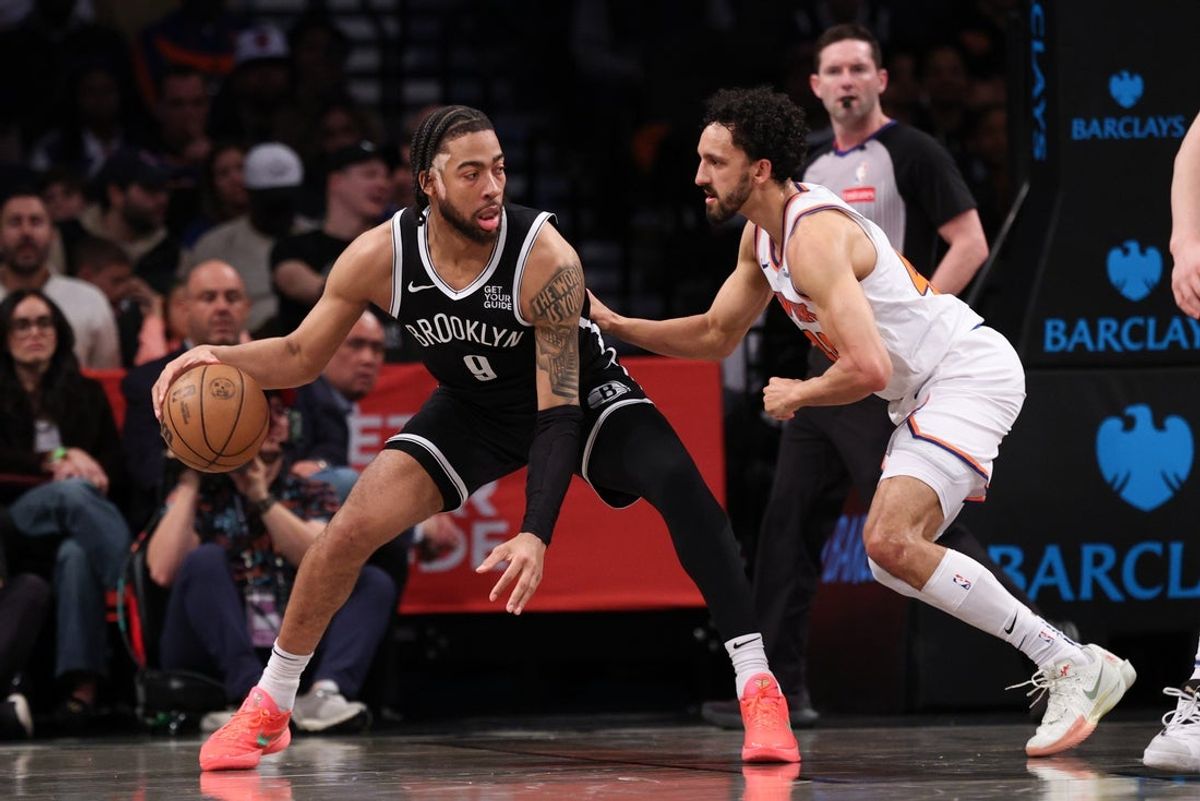 Apr 13, 2025; Brooklyn, New York, USA; Brooklyn Nets forward Trendon Watford (9) is guarded by New York Knicks guard Landry Shamet (44) during the first half at Barclays Center. Mandatory Credit: Vincent Carchietta-Imagn Images