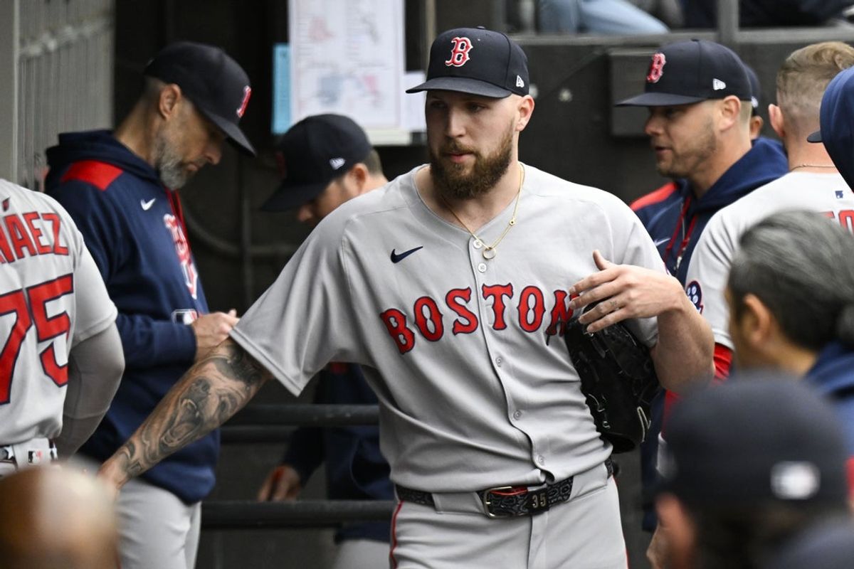 Apr 13, 2025; Chicago, Illinois, USA;  Boston Red Sox pitcher Garrett Crochet (35) high fives teammates after he pitched against the Chicago White Sox during the first inning at Guaranteed Rate Field. Mandatory Credit: Matt Marton-Imagn Images