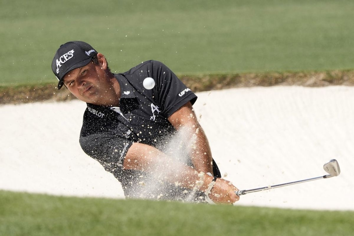 Apr 13, 2025; Augusta, Georgia, USA; Patrick Reed plays a shot from a bunker on the second hole during the final round of the Masters Tournament at Augusta National Golf Club. Mandatory Credit: Michael Madrid-Imagn Images