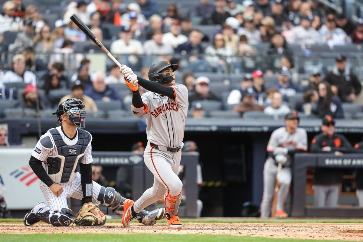 Apr 13, 2025; Bronx, New York, USA;  San Francisco Giants center fielder Jung Hoo Lee (51) hits a three-run home run in the sixth inning against the New York Yankees at Yankee Stadium. Mandatory Credit: Wendell Cruz-Imagn Images