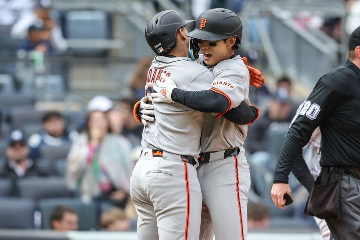 Apr 13, 2025; Bronx, New York, USA;  San Francisco Giants center fielder Jung Hoo Lee (51) celebrates with  shortstop Willy Adames (2) after hitting a three-run home run in the sixth inning against the New York Yankees at Yankee Stadium. Mandatory Credit: Wendell Cruz-Imagn Images