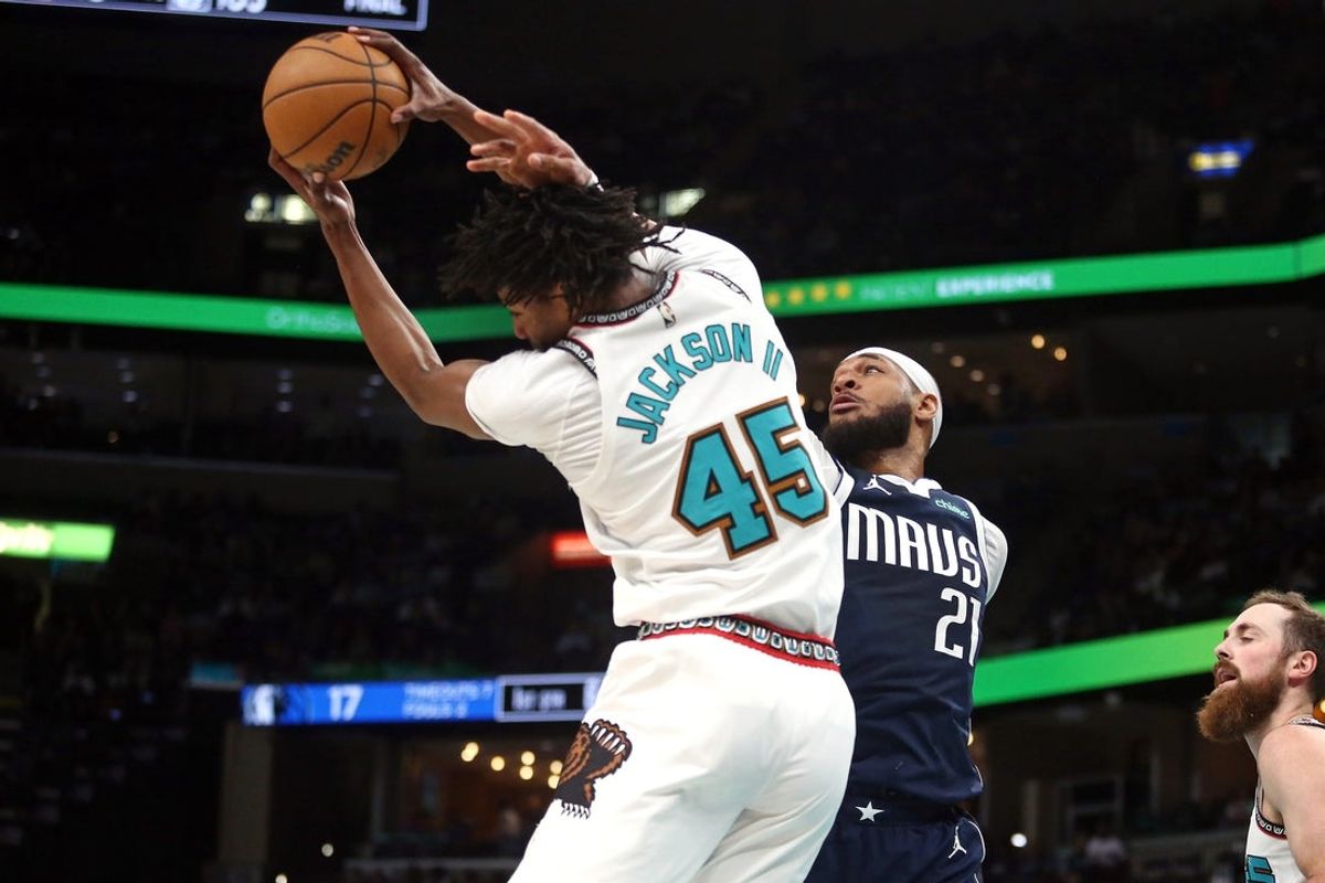 Apr 13, 2025; Memphis, Tennessee, USA; Memphis Grizzlies forward GG Jackson II (45) and Dallas Mavericks center Daniel Gafford (21) reach for a rebound during the first quarter at FedExForum. Mandatory Credit: Petre Thomas-Imagn Images