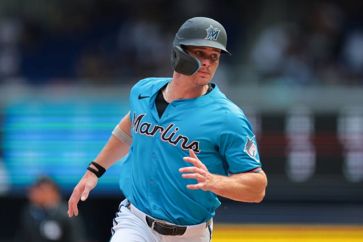 Apr 13, 2025; Miami, Florida, USA; Miami Marlins left fielder Griffin Conine (18) runs past third base to score on a sacrifice fly by Miami Marlins catcher Liam Hicks (not pictured) during the sixth inning at loanDepot Park. Mandatory Credit: Sam Navarro-Imagn Images