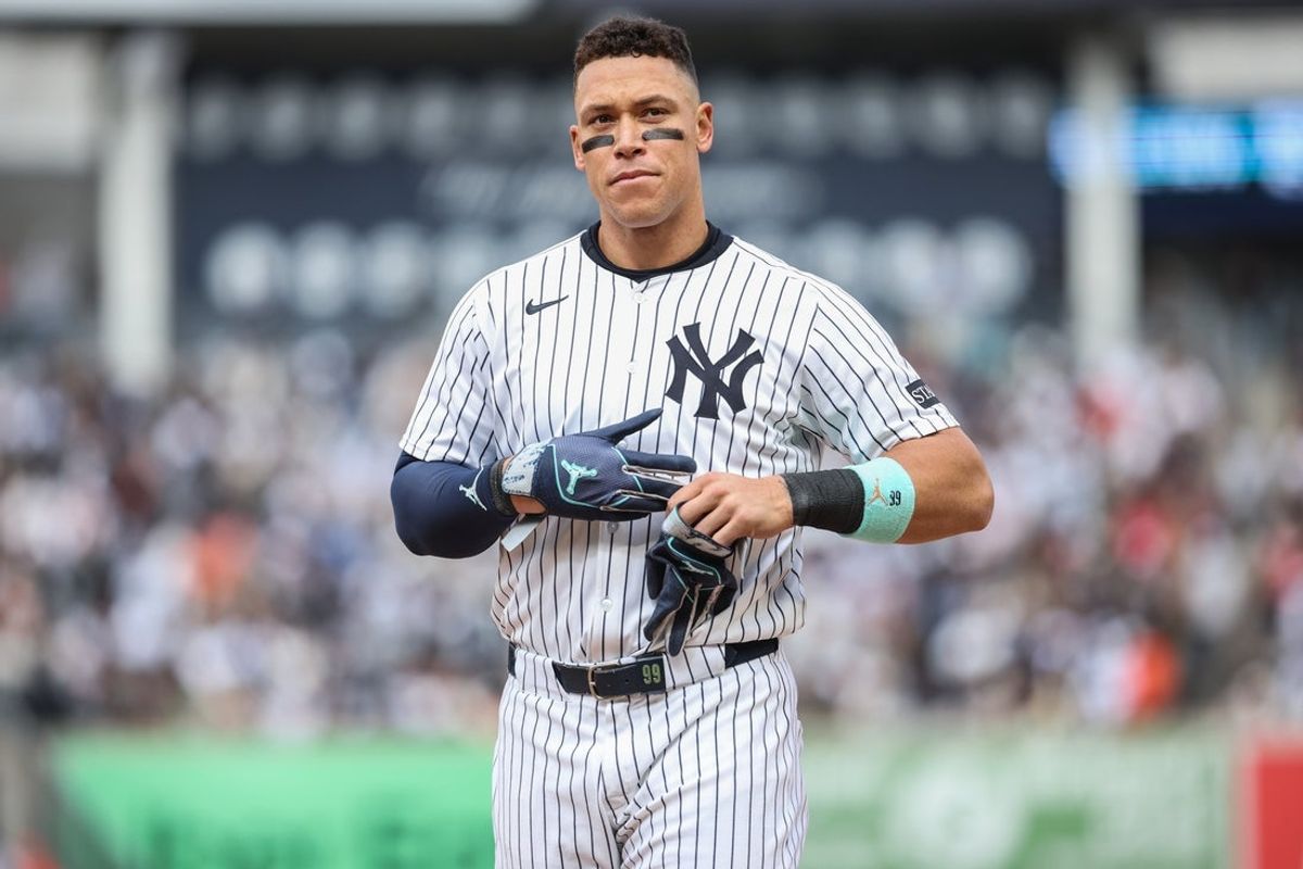 Apr 13, 2025; Bronx, New York, USA;  New York Yankees right fielder Aaron Judge (99) heads back to the field after getting stranded on first base in the seventh inning against the San Francisco Giants at Yankee Stadium. Mandatory Credit: Wendell Cruz-Imagn Images