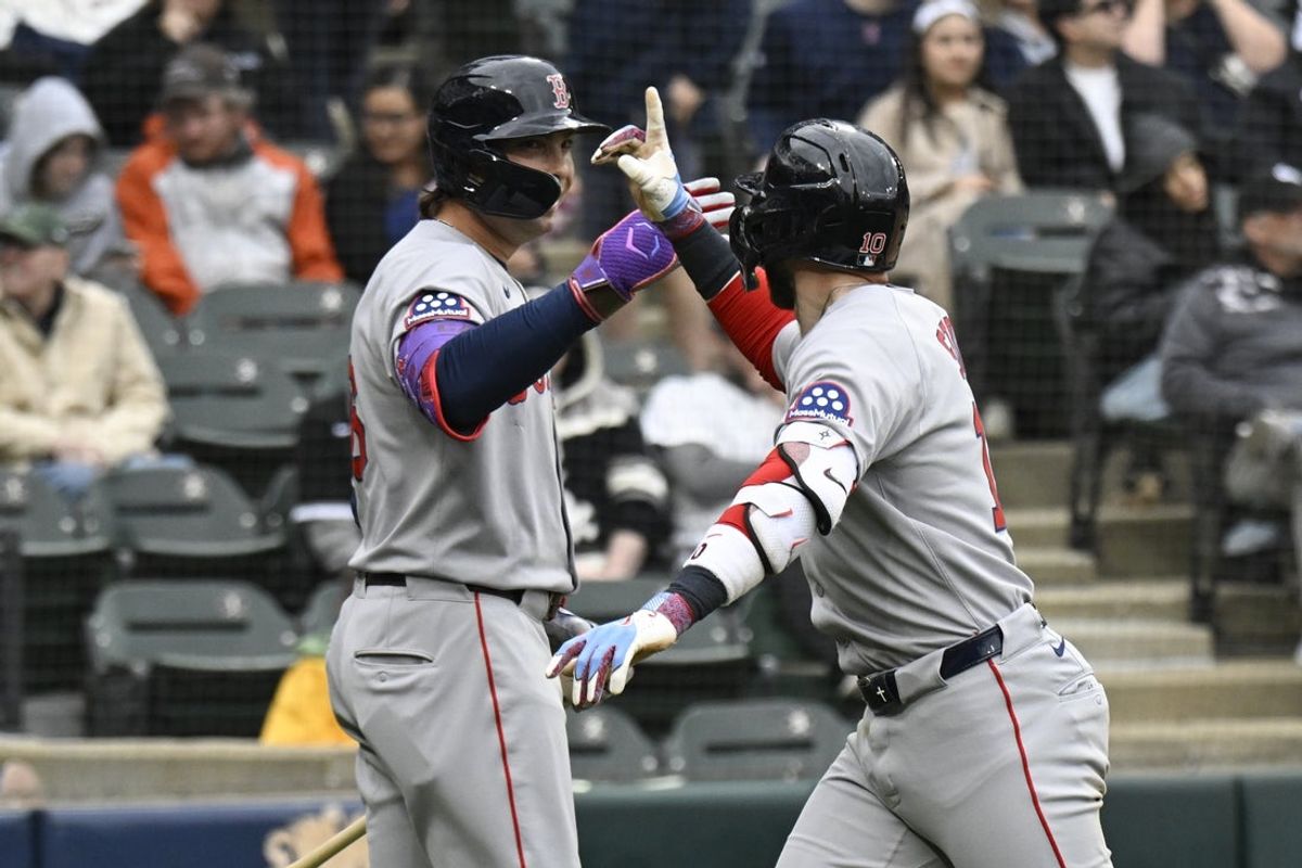 Apr 13, 2025; Chicago, Illinois, USA;  Boston Red Sox shortstop Trevor Story (10) high fives  first baseman  Triston Casas (36) after he hits a home run against the Chicago White Sox during the ninth inning at Guaranteed Rate Field. Mandatory Credit: Matt Marton-Imagn Images