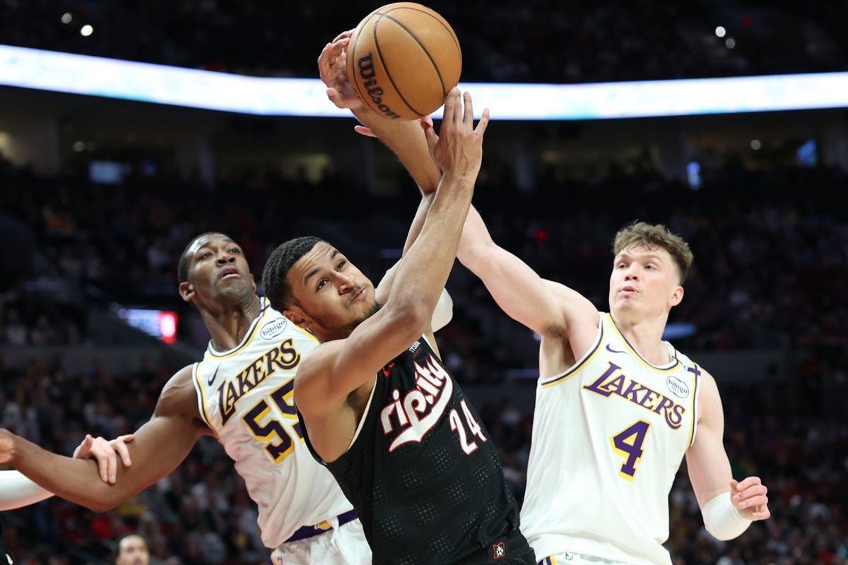 Apr 13, 2025; Portland, Oregon, USA;  Portland Trail Blazers forward Kris Murray (24) fights for a rebound against Los Angeles Lakers center Trey Jemison III (55) and Lakers’ guard Dalton Knecht (4) in the first half at Moda Center. Mandatory Credit: Jaime Valdez-Imagn Images