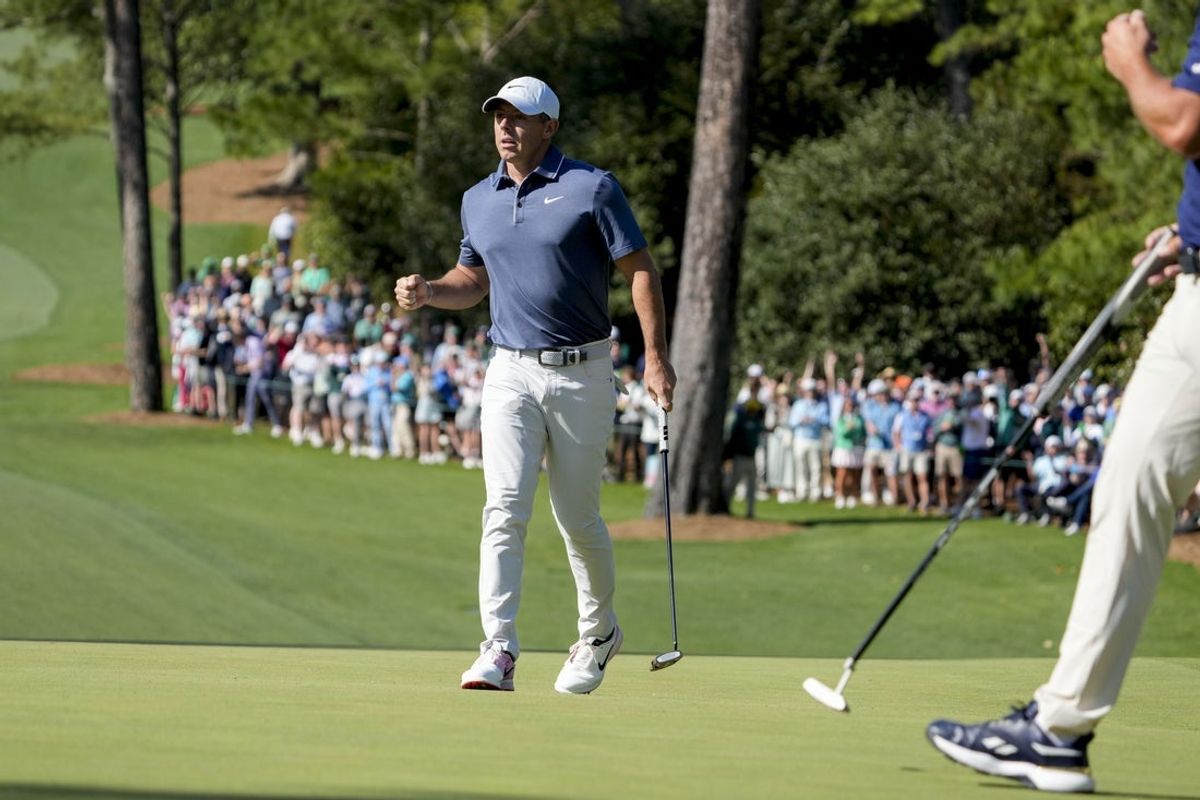 Apr 13, 2025; Augusta, Georgia, USA; Rory McIlroy reacts after making his putt on no. 10 during the final round of the Masters Tournament at Augusta National Golf Club. Mandatory Credit: Kyle Terada-Imagn Images