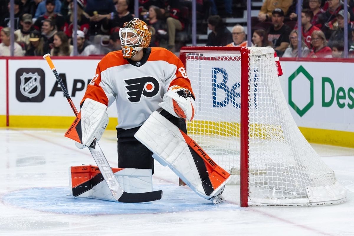 Apr 13, 2025; Ottawa, Ontario, CAN; Philadelphia Flyers goalie Ivan Fedotov (82) stretches prior to the start of game against the Ottawa Senators at the Canadian Tire Centre. Mandatory Credit: Marc DesRosiers-Imagn Images