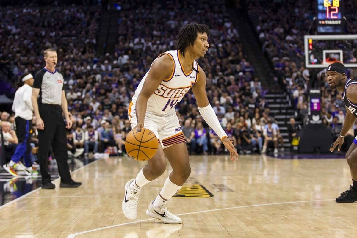 Apr 13, 2025; Sacramento, California, USA;  Phoenix Suns guard TyTy Washington Jr. (14) dribbles against the Sacramento Kings during the fourth quarter at Golden 1 Center. Mandatory Credit: John Hefti-Imagn Images