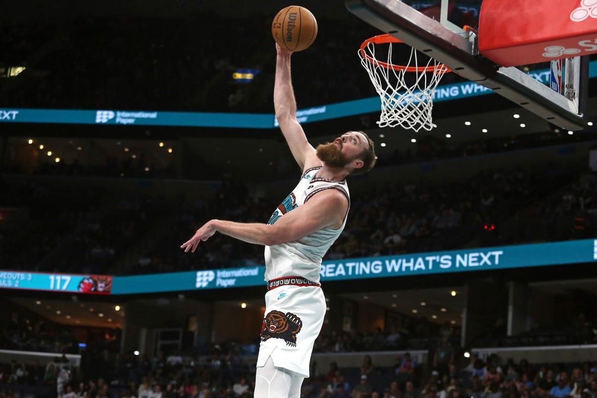 Apr 13, 2025; Memphis, Tennessee, USA; Memphis Grizzlies center Jay Huff (30) dunks during the fourth quarter against the Dallas Mavericks at FedExForum. Mandatory Credit: Petre Thomas-Imagn Images