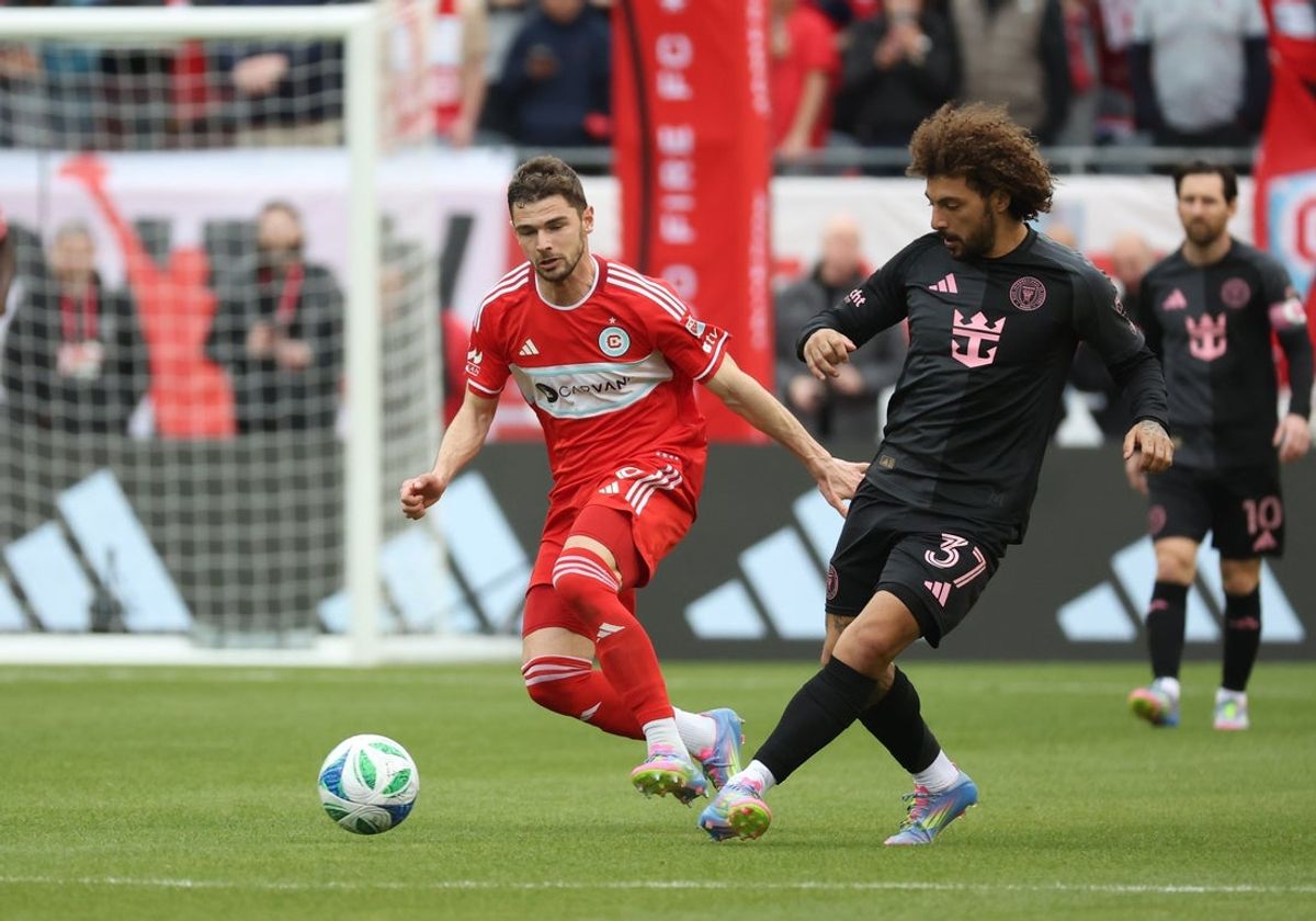 Apr 13, 2025; Chicago, Illinois, USA;  Inter Miami CF defender Maximiliano Falcón (37) and Chicago Fire FC forward Hugo Cuypers (9) battle for control of the ball during the second half at Soldier Field. Mandatory Credit: Talia Sprague-Imagn Images