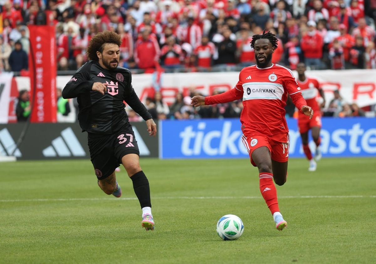 Apr 13, 2025; Chicago, Illinois, USA;  Chicago Fire FC forward Jonathan Bamba (19) and Inter Miami CF defender Maximiliano Falcón (37) battle for control of the ball during the second half at Soldier Field. Mandatory Credit: Talia Sprague-Imagn Images