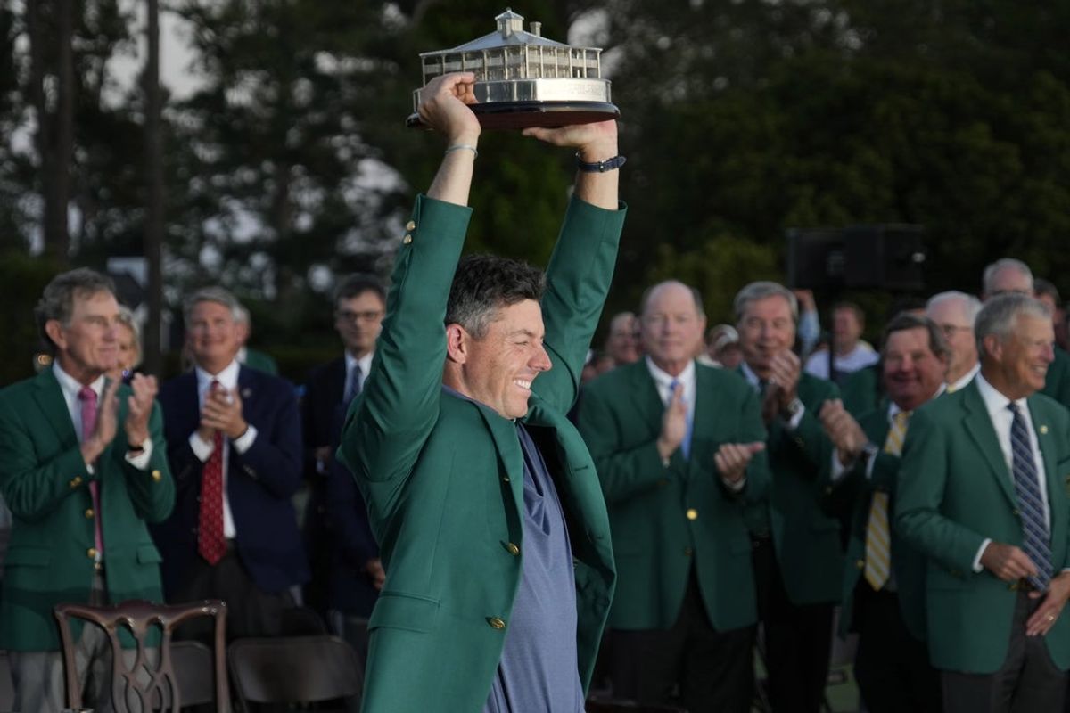Apr 13, 2025; Augusta, Georgia, USA; Rory McIlroy celebrates with the trophy after winning the Masters Tournament at Augusta National Golf Club. Mandatory Credit: Michael Madrid-Imagn Images