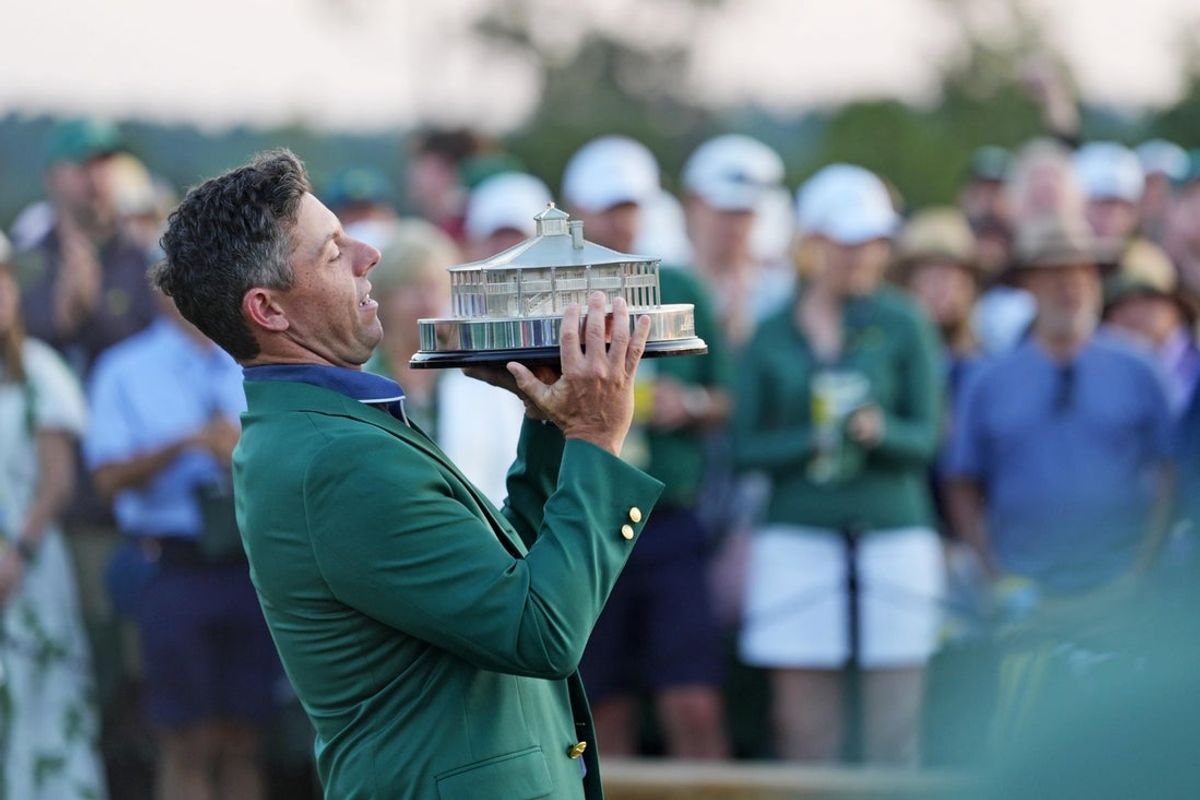 Apr 13, 2025; Augusta, Georgia, USA; Rory McIlroy reacts during the Masters Championship Trophy ceremony after the final round of the Masters Tournament at Augusta National Golf Club. Mandatory Credit: Katie Goodale-Imagn Images