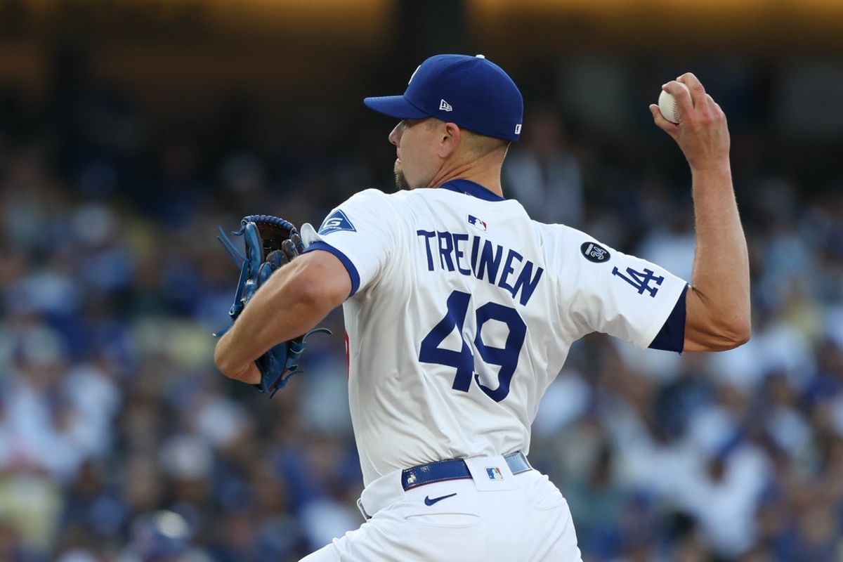 Apr 13, 2025; Los Angeles, California, USA; Los Angeles Dodgers pitcher Blake Treinen (49) throws a pitch against the Chicago Cubs during the seventh inning of the game at Dodger Stadium. Mandatory Credit: Kiyoshi Mio-Imagn Images