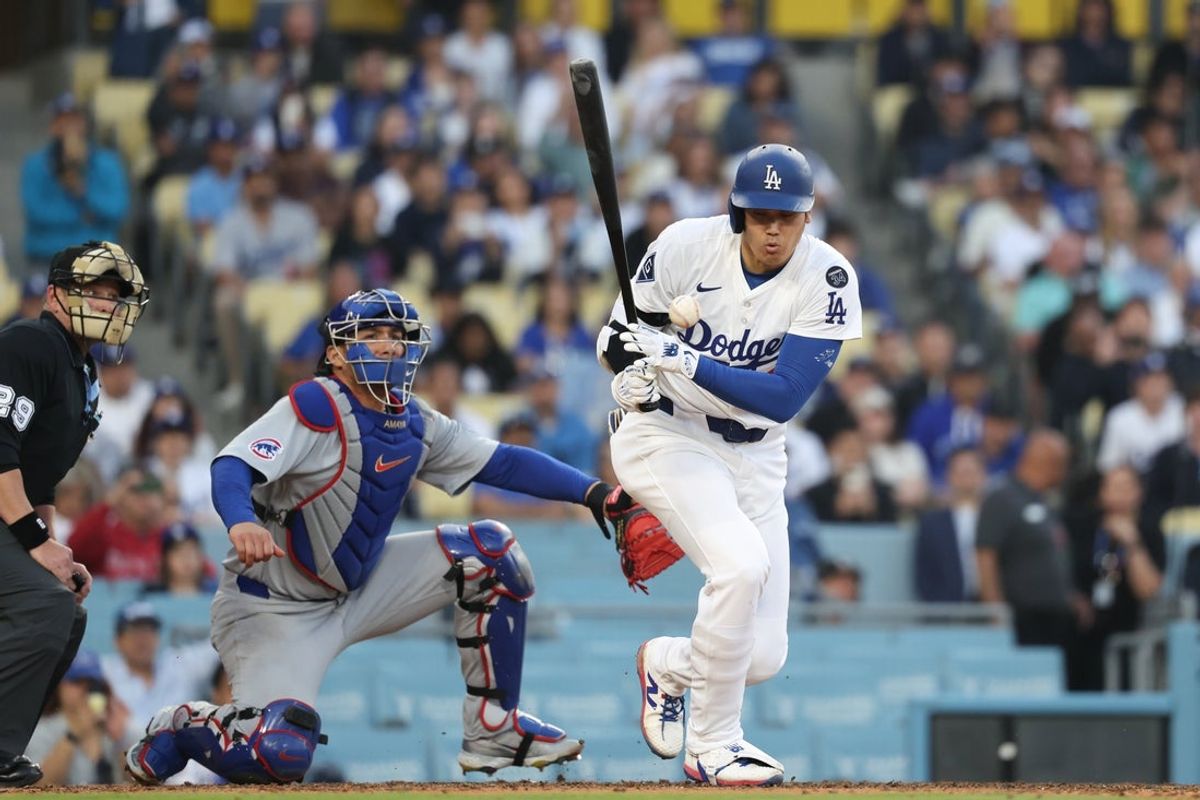 Apr 13, 2025; Los Angeles, California, USA; Los Angeles Dodgers designated hitter player Shohei Ohtani (17) reacts after hitting the ball foul against the Chicago Cubs during the ninth inning of the game at Dodger Stadium. Mandatory Credit: Kiyoshi Mio-Imagn Images
