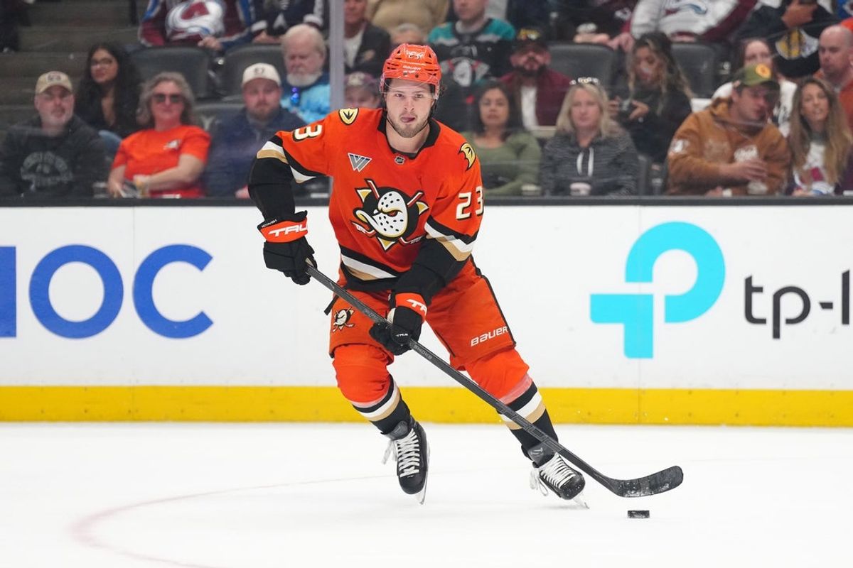 Apr 13, 2025; Anaheim, California, USA; Anaheim Ducks center Mason McTavish (23) skates with the puck against the Colorado Avalanche in the first period at Honda Center. Mandatory Credit: Kirby Lee-Imagn Images