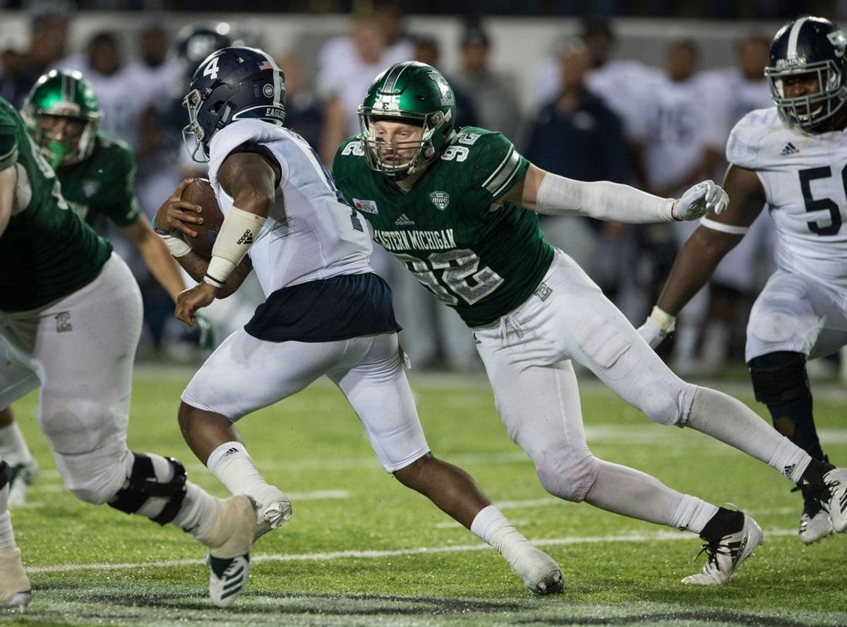 Georgia Southern quarterback Shai Werts (4) is taken down by Eastern Michigan defensive lineman Maxx Crosby (92) during the Camellia Bowl at Cramton Bowl in Montgomery, Ala., on Saturday, Dec. 15, 2018. Georgia Southern defeated Eastern Michigan 23-21. 

Jc Camellia 31