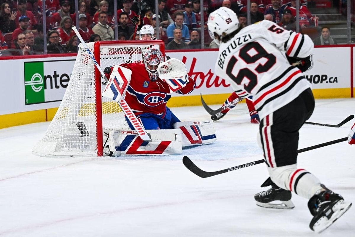 Apr 14, 2025; Montreal, Quebec, CAN; Chicago Blackhawks defenseman Artyom Levshunov (55) scores a goal against Montreal Canadiens goalie Sam Montembeault (35) in the first period at Bell Centre. Mandatory Credit: David Kirouac-Imagn Images