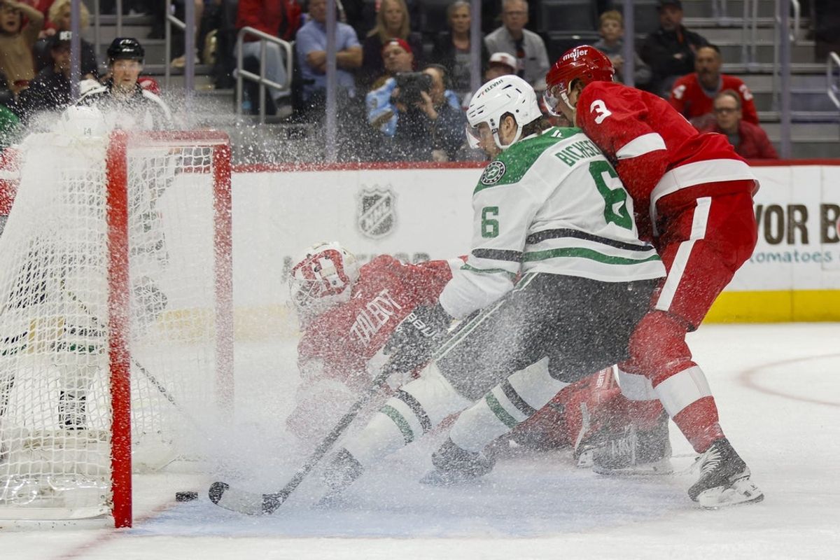 Apr 14, 2025; Detroit, Michigan, USA; Dallas Stars defenseman Lian Bichsel (6) scores a goal on Detroit Red Wings goaltender Cam Talbot (39) during the first period at Little Caesars Arena. Mandatory Credit: Brian Bradshaw Sevald-Imagn Images