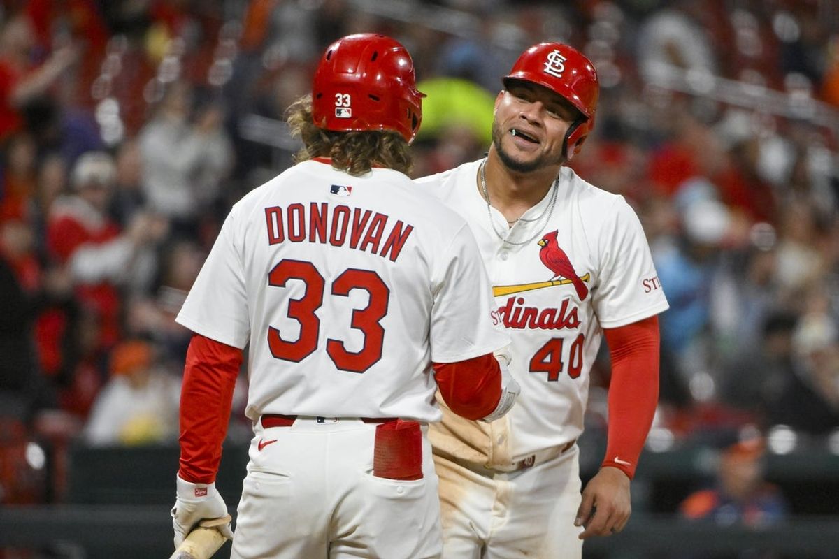 Apr 14, 2025; St. Louis, Missouri, USA;  St. Louis Cardinals first baseman Willson Contreras (40) celebrates with shortstop Brendan Donovan (33) after scoring against the Houston Astros during the fifth inning at Busch Stadium. Mandatory Credit: Jeff Curry-Imagn Images