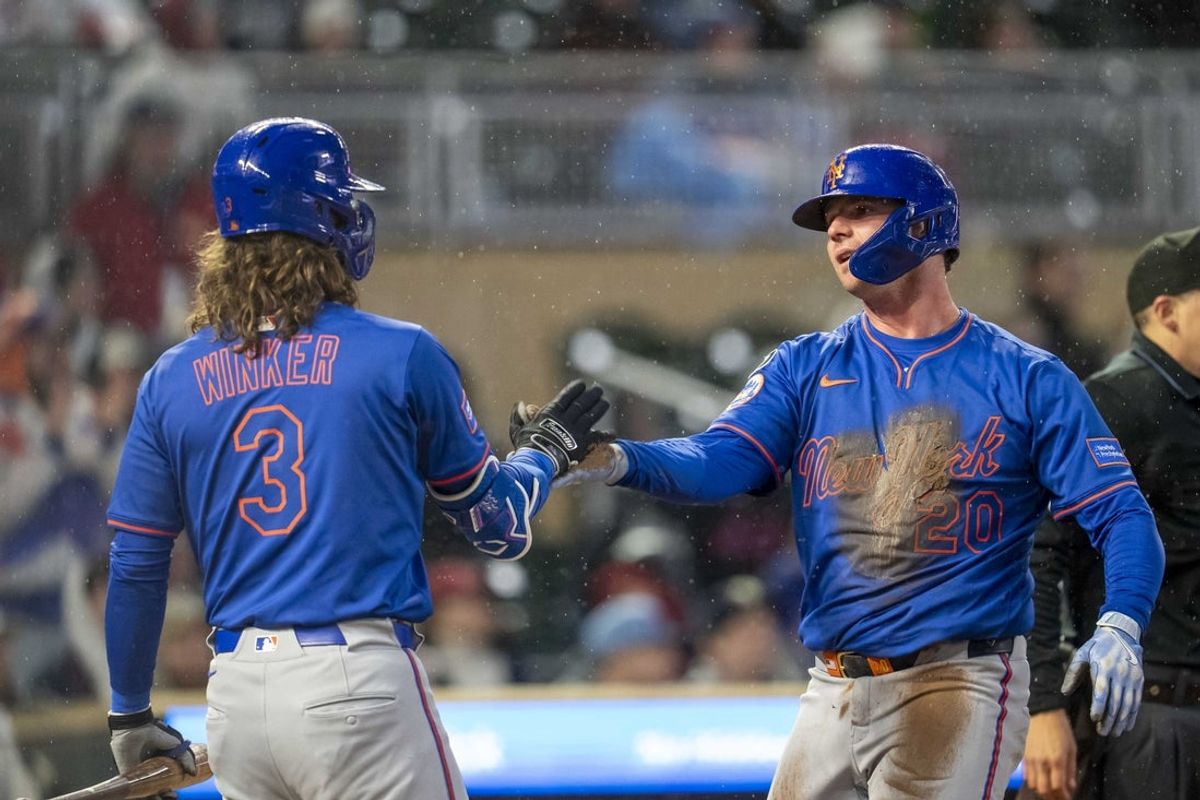 Apr 14, 2025; Minneapolis, Minnesota, USA; New York Mets first baseman Pete Alonso (20) celebrates with designed hitter Jesse Winker (3) after scoring against the Minnesota Twins in the sixth inning at Target Field. Mandatory Credit: Jesse Johnson-Imagn Images