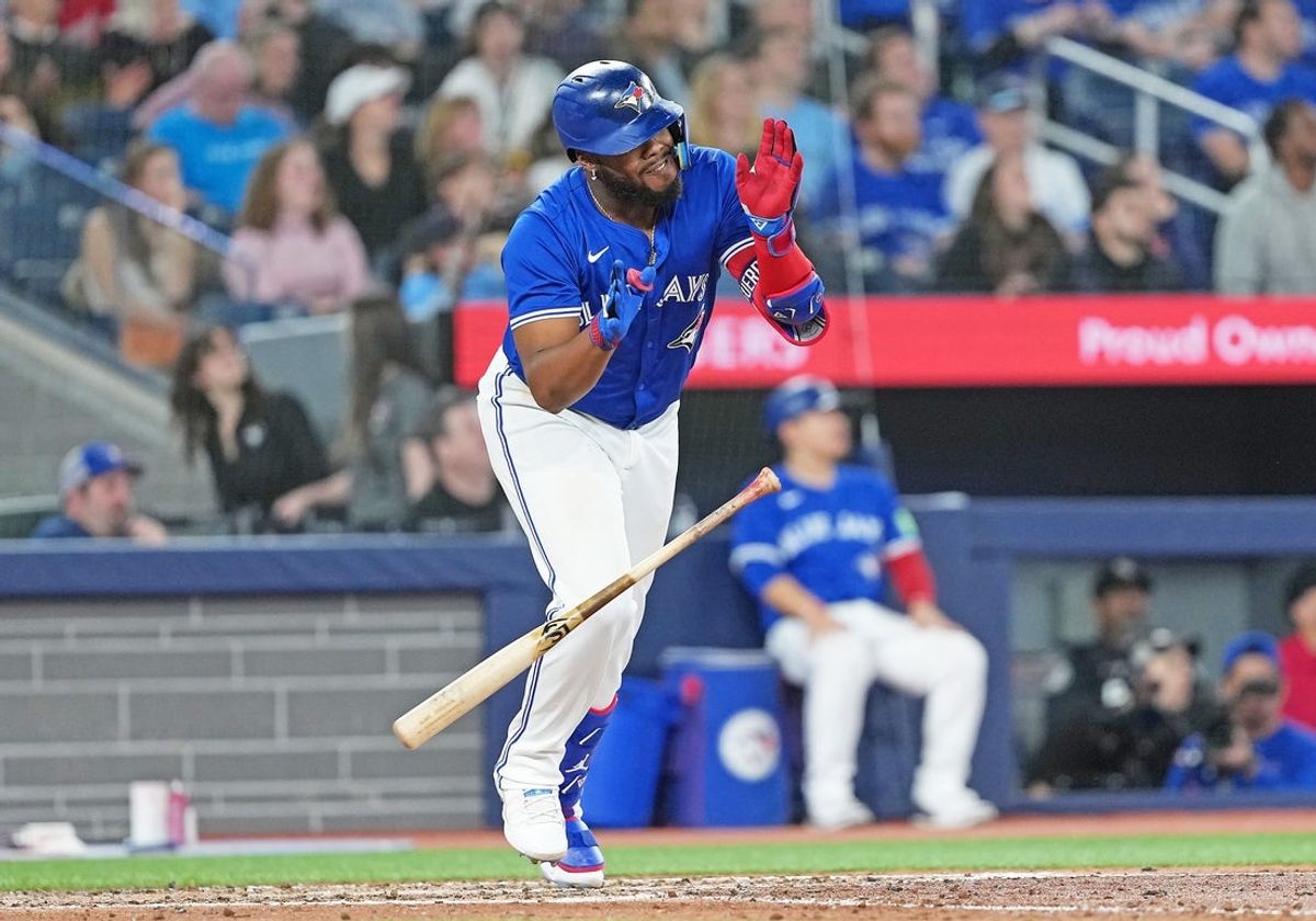 Apr 14, 2025; Toronto, Ontario, CAN; Toronto Blue Jays first baseman Vladimir Guerrero Jr. (27) reacts after hitting a fly ball for an out against the Atlanta Braves during the seventh inning at Rogers Centre. Mandatory Credit: Nick Turchiaro-Imagn Images