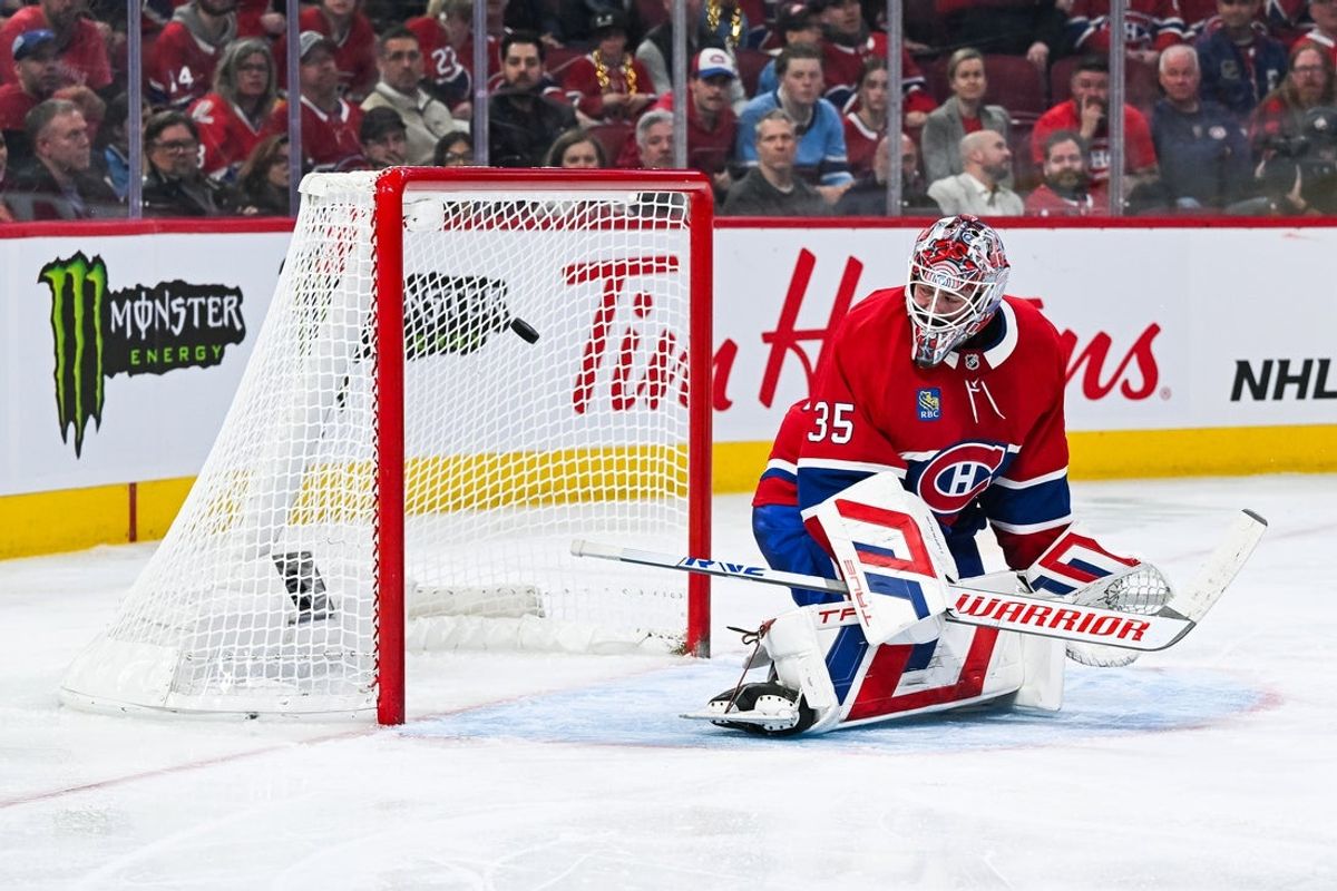 Apr 14, 2025; Montreal, Quebec, CAN; Chicago Blackhawks left wing Lukas Reichel (73) (not pictured) scores a goal against Montreal Canadiens goalie Sam Montembeault (35) in the third period at Bell Centre. Mandatory Credit: David Kirouac-Imagn Images