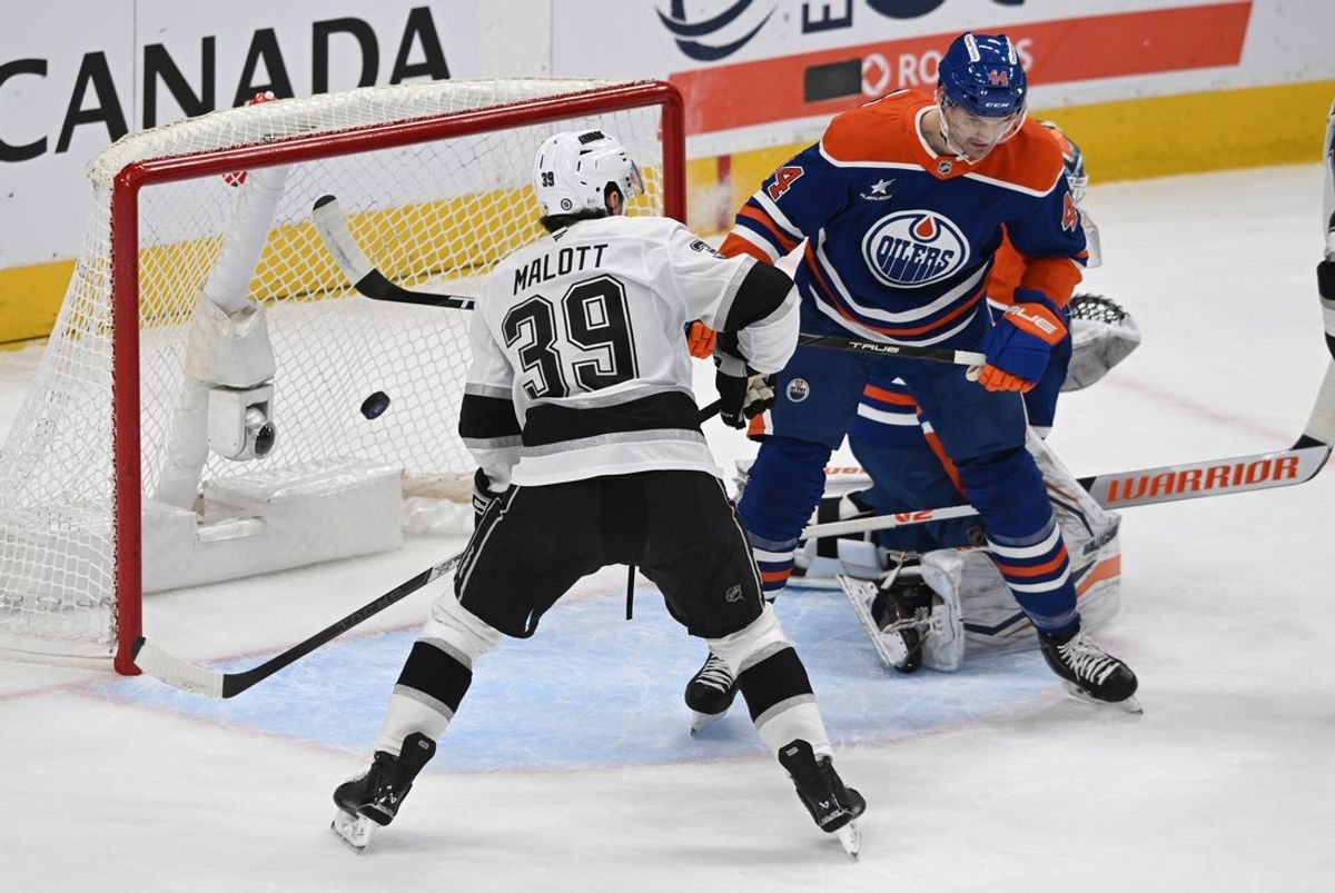 Apr 14, 2025; Edmonton, Alberta, CAN; Los Angeles Kings left wing Jeff Malott (39) battles with Edmonton Oilers defenseman Joshua Borwn (44) in front of Oilers goalie Calvin Pickard (30) during the first period at Rogers Place. Mandatory Credit: Walter Tychnowicz-Imagn Images
