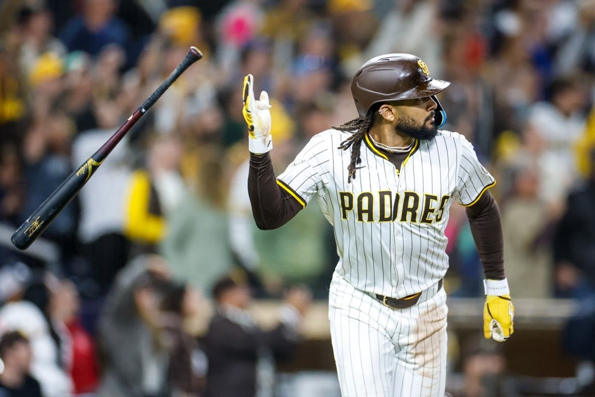Apr 14, 2025; San Diego, California, USA;  San Diego Padres right fielder Fernando Tatis Jr. (23) flips his bat after hitting a two run home run during the eighth inning against the Chicago Cubs at Petco Park. Mandatory Credit: David Frerker-Imagn Images