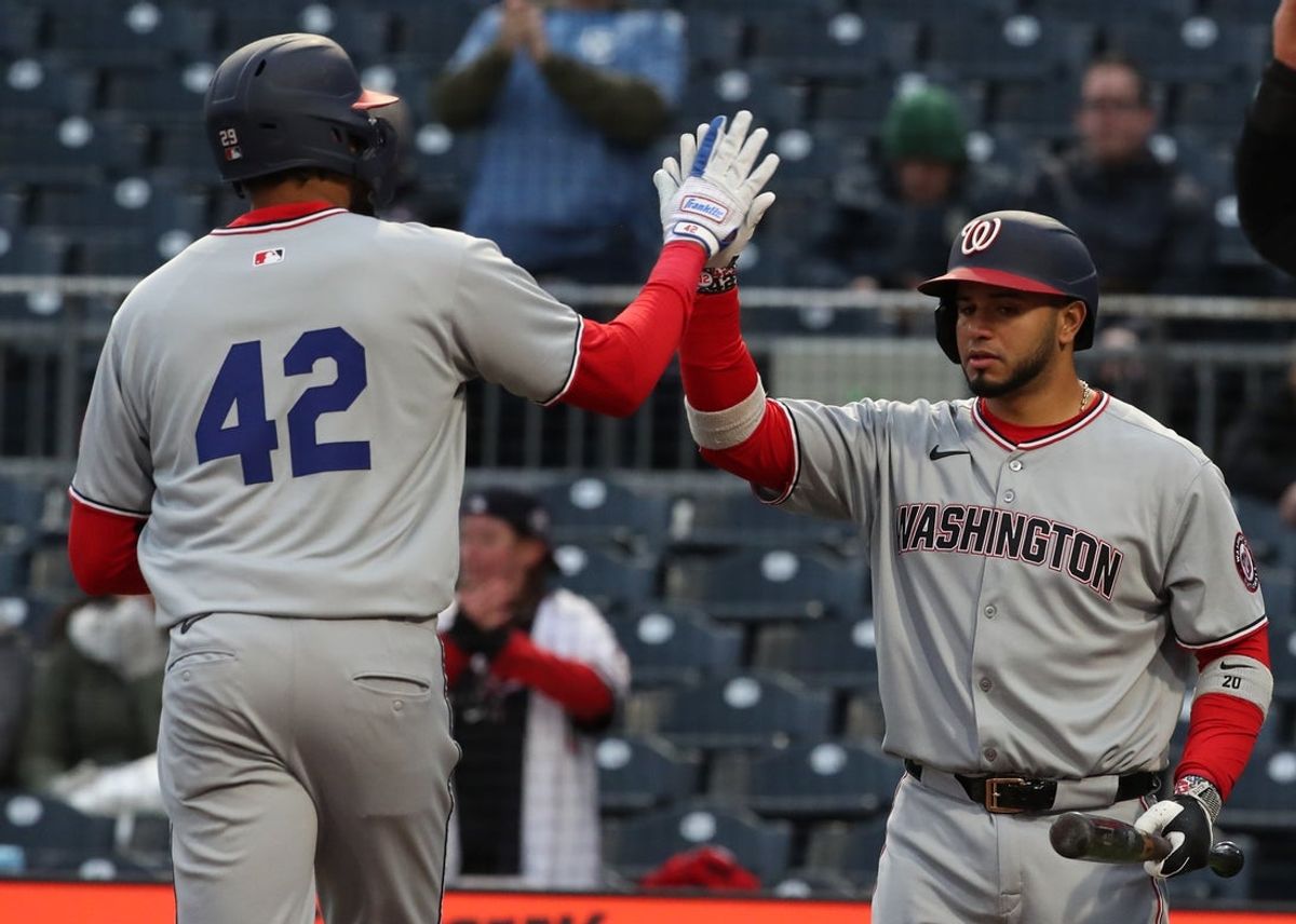 Apr 15, 2025; Pittsburgh, Pennsylvania, USA;  Washington Nationals catcher Keibert Ruiz (right) congratulates left fielder James Wood (left) crossing home plate on a solo home run against the Pittsburgh Pirates during the first inning at PNC Park. Mandatory Credit: Charles LeClaire-Imagn Images