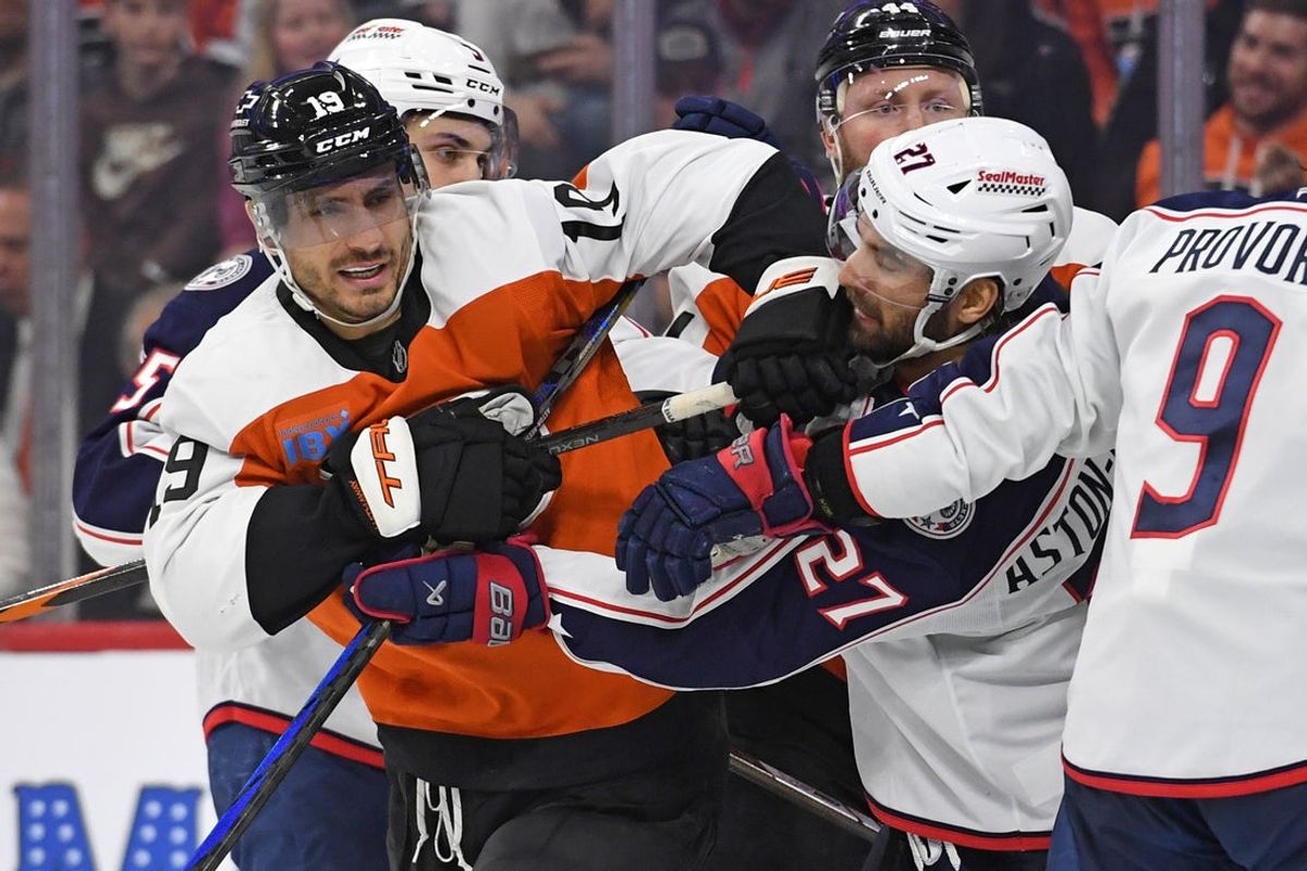 Apr 15, 2025; Philadelphia, Pennsylvania, USA; Philadelphia Flyers right wing Garnet Hathaway (19) and Columbus Blue Jackets center Zachary Aston-Reese (27) battle during the second period at Wells Fargo Center. Mandatory Credit: Eric Hartline-Imagn Images