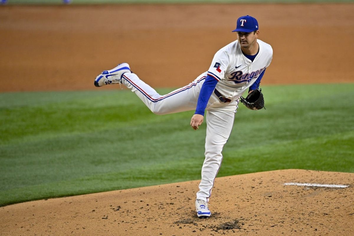 Apr 15, 2025; Arlington, Texas, USA; Texas Rangers starting pitcher Tyler Mahle pitches against the Los Angeles Angels during the second inning at Globe Life Field. All MLB players will be wearing the number 42 on Jackie Robinson Day to commemorate Robinson making his major league debut in 1947. Mandatory Credit: Jerome Miron-Imagn Images